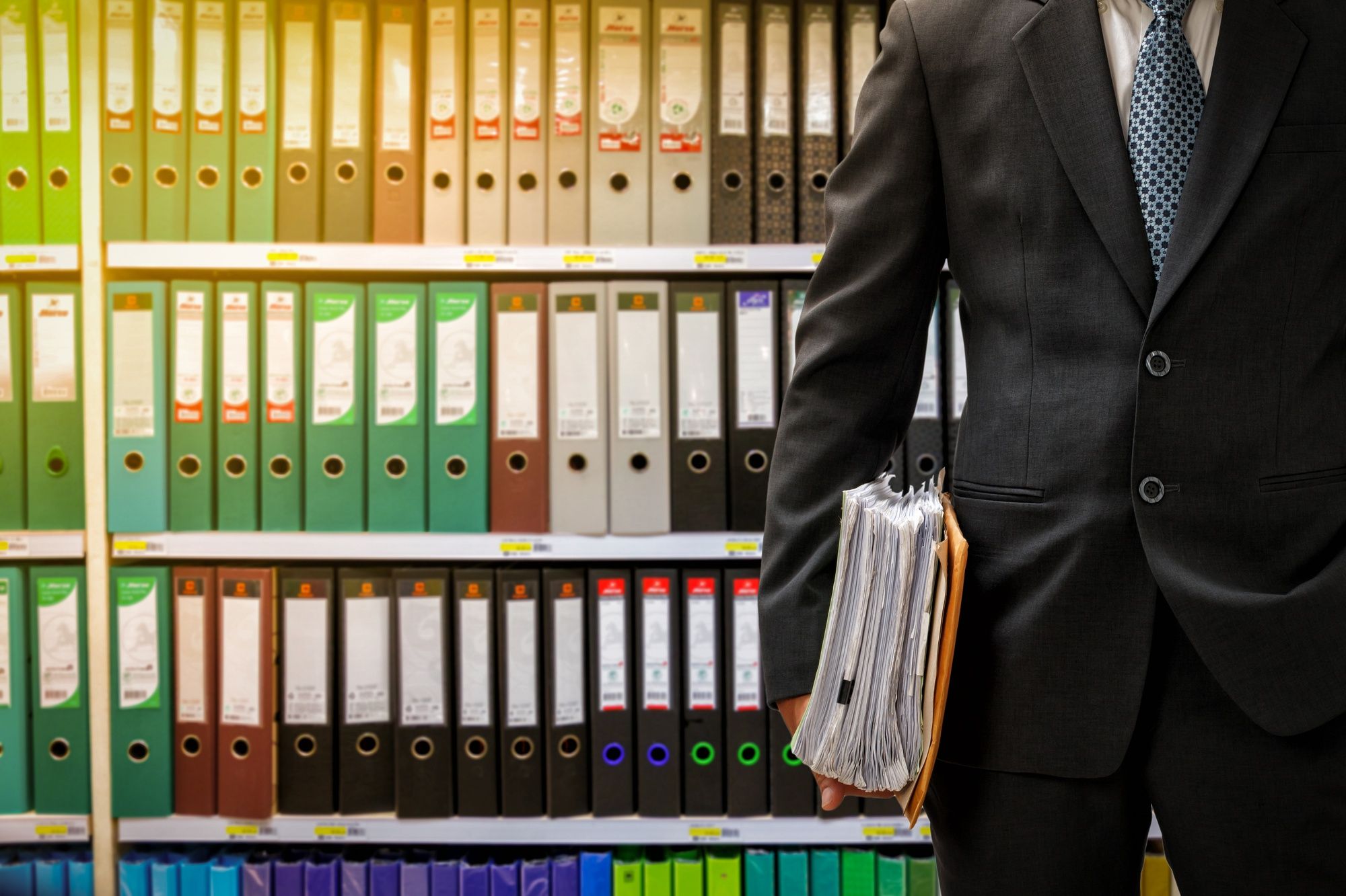 businessman-holding-data-files